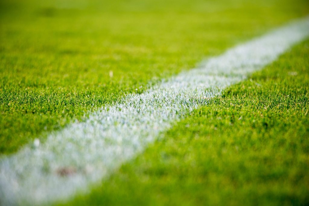 An image of a white line on a football pitch